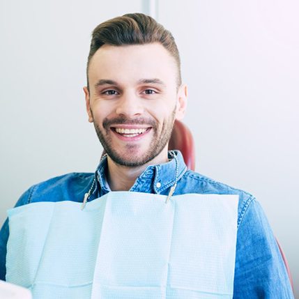 a patient smiling during his dental visit