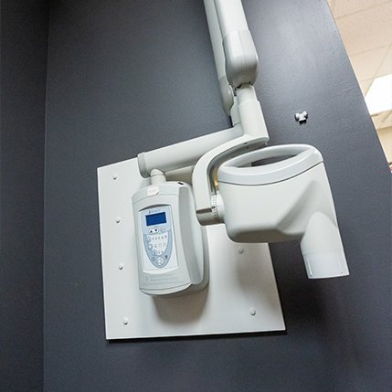Digital dental x ray device attached to wall