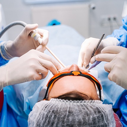 Dentists performing procedure on patient
