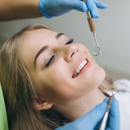 Young woman smiling at her dental checkup