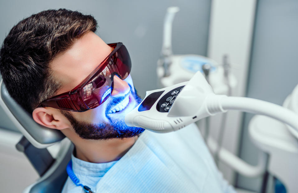 Man getting dental whitening treatment